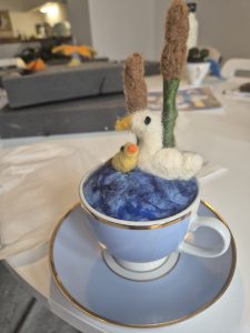 Learn how to needle felt a scene in a teacup, ducks in a pond, wool felting in a teacup.