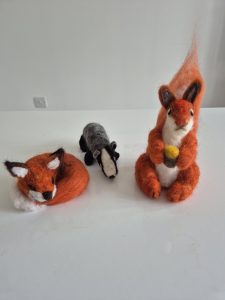 Felted red squirrel, felted fox and badger. 